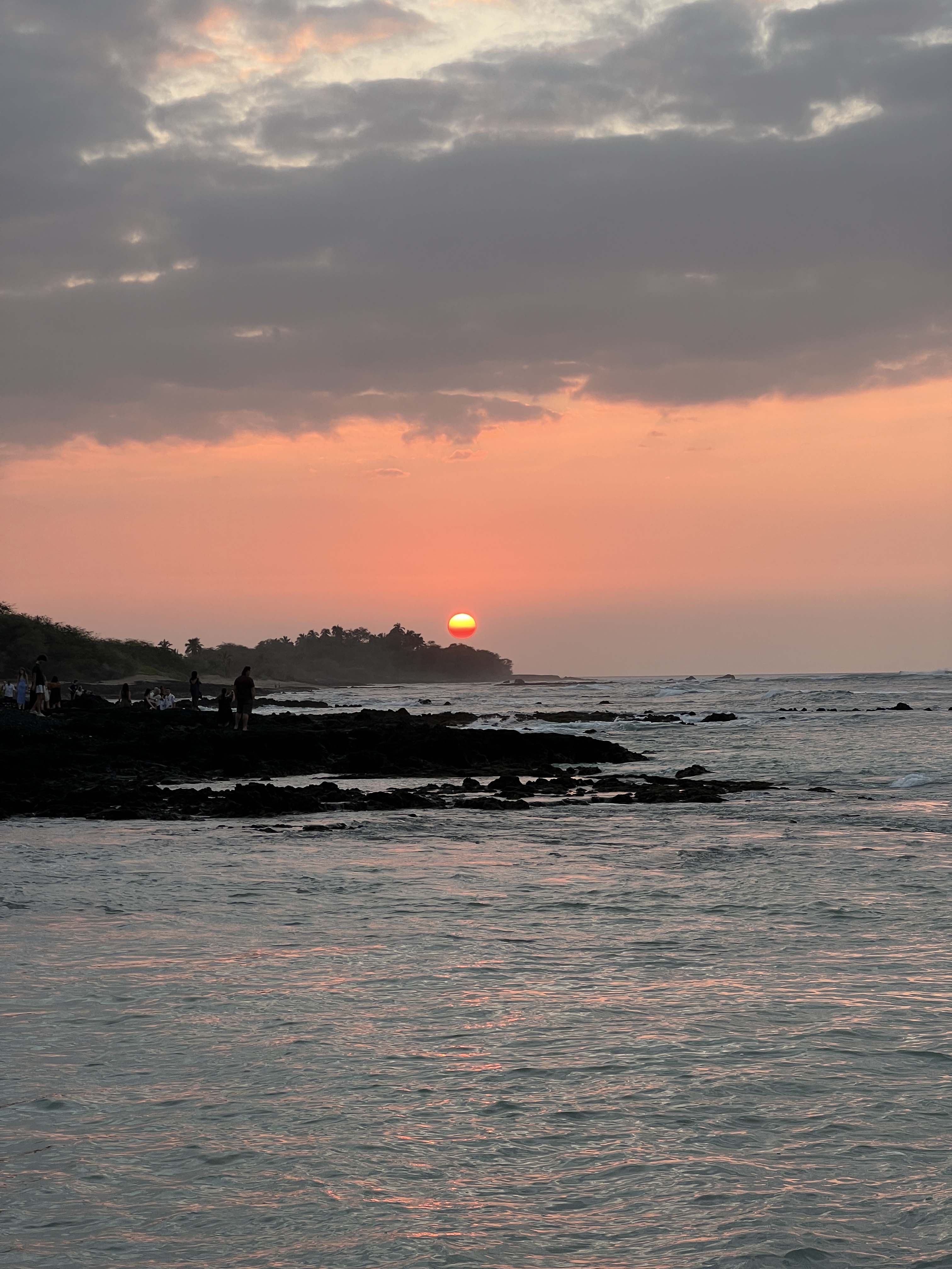 The sun setting over the ocean.