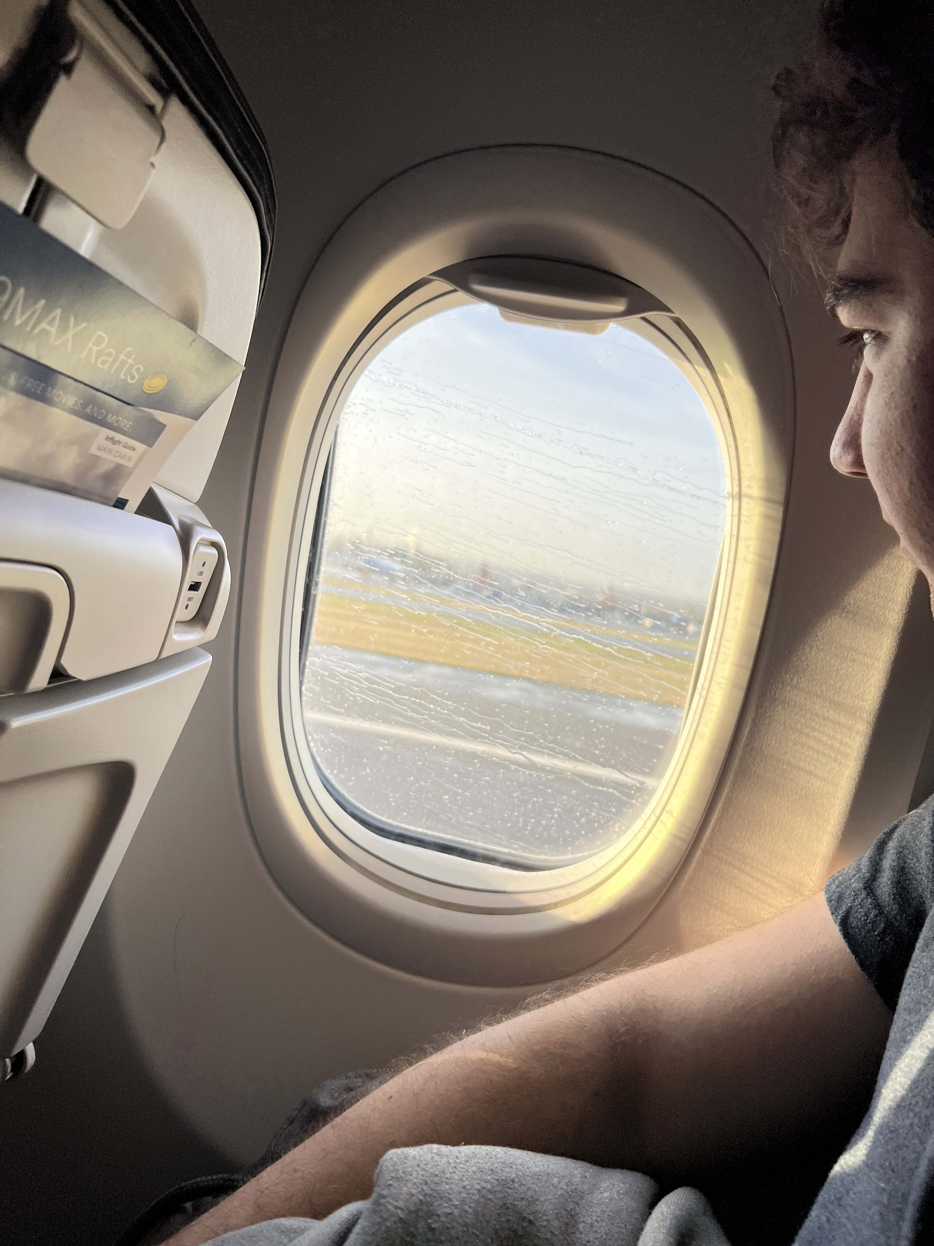 Ryan looking out of the plane window as we are taking off.